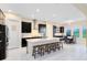 Spacious eat-in kitchen features a large island with seating and stainless steel appliances at 16696 Otterchase Ln, Winter Garden, FL 34787
