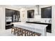 Gourmet kitchen featuring a large island with bar seating, stainless appliances, and modern cabinetry at 16696 Otterchase Ln, Winter Garden, FL 34787