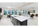 Bright eat-in kitchen featuring stainless steel appliances, tile floors and connected living area at 16696 Otterchase Ln, Winter Garden, FL 34787