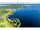 Breathtaking aerial view of the lake and surrounding landscapes, with lush greenery at 16696 Otterchase Ln, Winter Garden, FL 34787
