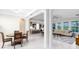 Open-concept living area with dining room, living room and kitchen with seamless flow and modern finishes at 16696 Otterchase Ln, Winter Garden, FL 34787