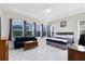 Large main bedroom features tile floors, large windows and a comfortable lounge area at 16696 Otterchase Ln, Winter Garden, FL 34787