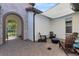 Outdoor patio with comfortable seating, fire pit, and shade, perfect for entertaining at 16696 Otterchase Ln, Winter Garden, FL 34787