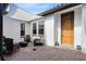 Patio with outdoor seating, a fire pit, sun shade and access to front door at 16696 Otterchase Ln, Winter Garden, FL 34787