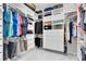 Spacious walk-in closet with custom shelving, drawers, and ample storage at 16696 Otterchase Ln, Winter Garden, FL 34787