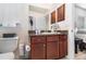 This half bathroom features a single sink vanity, dark wood cabinets, and ample counter space at 186 Nw 44Th St, Ocala, FL 34475