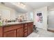 Bathroom featuring dual sinks, modern fixtures, and a glass enclosed shower at 186 Nw 44Th St, Ocala, FL 34475