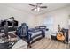 Bedroom with gaming setup, wood floors, and natural light from window at 186 Nw 44Th St, Ocala, FL 34475