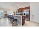 Kitchen island featuring a granite countertop, stainless steel appliances, and ample seating for casual dining at 186 Nw 44Th St, Ocala, FL 34475