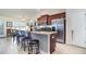 Kitchen with stainless steel appliances and granite counters, offering seating and views into the living area at 186 Nw 44Th St, Ocala, FL 34475