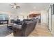 Spacious living room with tile floors, ceiling fan, and neutral decor connecting to the kitchen area at 186 Nw 44Th St, Ocala, FL 34475