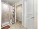 Bathroom featuring a glass shower enclosure, tiled walls, and modern fixtures at 186 Nw 44Th St, Ocala, FL 34475
