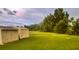 Backyard with storage sheds and a lush green lawn at 1980 Aquarius Ct, Oviedo, FL 32766