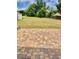Spacious backyard with a lush lawn and a charming brick patio, ideal for outdoor entertaining and relaxation at 1980 Aquarius Ct, Oviedo, FL 32766