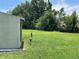 Large backyard with storage shed, open space, and grassy lawn at 1980 Aquarius Ct, Oviedo, FL 32766