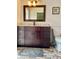 Bathroom featuring a brown vanity with granite countertop and dark bronze fixtures at 1980 Aquarius Ct, Oviedo, FL 32766