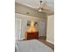 Inviting bedroom with a ceiling fan, hardwood floors, and a warm ambiance, providing a peaceful retreat at 1980 Aquarius Ct, Oviedo, FL 32766