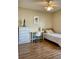 Serene bedroom featuring a twin bed, desk, dresser, and a ceiling fan, perfect for relaxing or studying at 1980 Aquarius Ct, Oviedo, FL 32766