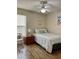 Cozy bedroom offers a comfortable retreat with soft textures, a ceiling fan, and soothing color palette at 1980 Aquarius Ct, Oviedo, FL 32766