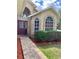 Welcoming entrance with brick-paved path and well-maintained landscaping leading to the beautiful front door at 1980 Aquarius Ct, Oviedo, FL 32766
