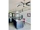 Modern kitchen featuring granite countertops, stainless steel appliances, a center island, and easy access to the living room at 1980 Aquarius Ct, Oviedo, FL 32766