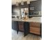 Spacious kitchen with granite countertops, stainless appliances and dark wood cabinets, offering ample storage at 1980 Aquarius Ct, Oviedo, FL 32766