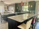 Bright kitchen with double island, modern cabinetry, granite countertops, pendant lighting, and stainless steel appliances at 1980 Aquarius Ct, Oviedo, FL 32766