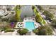 Overhead shot featuring a community pool, playground and pond providing a vibrant recreational space at 2204 San Vittorino Cir # 102, Kissimmee, FL 34741