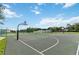 Outdoor basketball court offering recreational opportunities with multiple hoops and court lines at 2204 San Vittorino Cir # 102, Kissimmee, FL 34741