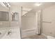 Bright bathroom with a tub/shower combo, large mirror, and white vanity at 2204 San Vittorino Cir # 102, Kissimmee, FL 34741