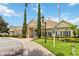 Inviting community clubhouse with manicured landscaping, prominent entrance, and ample parking for residents and guests at 2204 San Vittorino Cir # 102, Kissimmee, FL 34741