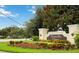 Entrance to the Venetian Bay Villages community featuring lush landscaping and signage at 2204 San Vittorino Cir # 102, Kissimmee, FL 34741