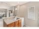 Bright kitchen featuring stainless steel sink, light wood cabinets, and an open layout to the living area at 2204 San Vittorino Cir # 102, Kissimmee, FL 34741