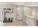 Inviting living room with tile floors and neutral paint, featuring a tv and a doorway to the exterior at 2204 San Vittorino Cir # 102, Kissimmee, FL 34741
