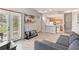 Open floor plan showcasing living room, kitchen, and staircase with abundant natural light and neutral tones at 2204 San Vittorino Cir # 102, Kissimmee, FL 34741