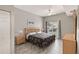 Comfortable main bedroom featuring a large bed, ceiling fan and view from the window at 2204 San Vittorino Cir # 102, Kissimmee, FL 34741