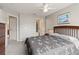 Comfortable primary bedroom features a ceiling fan and ensuite bathroom, offering a private retreat at 2204 San Vittorino Cir # 102, Kissimmee, FL 34741