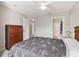 Inviting primary bedroom features a ceiling fan and ensuite bathroom, offering a private retreat at 2204 San Vittorino Cir # 102, Kissimmee, FL 34741