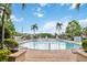 Lush pool area with decorative fountains, inviting lounge chairs, and clear blue water for relaxation and enjoyment at 2204 San Vittorino Cir # 102, Kissimmee, FL 34741