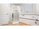 Bright bathroom featuring a shower, a soaking tub, and tile flooring at 2249 Palmetum Loop, Apopka, FL 32712