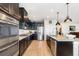 Kitchen featuring stainless steel appliances, granite countertops, and a large island at 2249 Palmetum Loop, Apopka, FL 32712