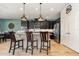 Kitchen view showing granite countertops, stainless steel appliances, and a spacious island at 2249 Palmetum Loop, Apopka, FL 32712