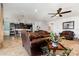 Open concept living room with a view into the kitchen and a comfortable seating area at 2249 Palmetum Loop, Apopka, FL 32712