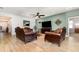 Spacious living room featuring stylish furnishings, a ceiling fan, and an open layout at 2249 Palmetum Loop, Apopka, FL 32712