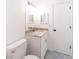 Updated bathroom with granite countertops, patterned tile floor, and a white vanity at 2486 Ainsworth Ave, Deltona, FL 32738