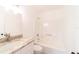 Fresh bathroom with tub and shower combination and vanity with stone counter at 2486 Ainsworth Ave, Deltona, FL 32738