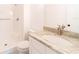 Bright bathroom featuring new vanity with granite countertop and tiled shower and flooring at 2486 Ainsworth Ave, Deltona, FL 32738
