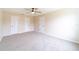 Clean bedroom with three closets, carpet and a ceiling fan at 2486 Ainsworth Ave, Deltona, FL 32738