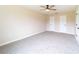 Cozy bedroom with neutral walls, ceiling fan, carpet, and two closets at 2486 Ainsworth Ave, Deltona, FL 32738