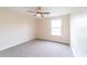 Bedroom features carpet, window letting in natural light, and neutral paint at 2486 Ainsworth Ave, Deltona, FL 32738